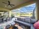 Covered patio overlooking hot tub and backyard at 16767 Rusty Anchor Rd, Winter Garden, FL 34787