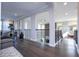 Open upper hallway with hardwood floors and iron railings at 16767 Rusty Anchor Rd, Winter Garden, FL 34787