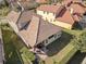 Aerial view of a private backyard with covered patio and outdoor seating, perfect for relaxing and entertaining at 1712 Whitney Isles Dr, Windermere, FL 34786