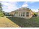 Expansive backyard showcasing well-maintained lawn, privacy landscaping, and ample space for outdoor activities and enjoyment at 1712 Whitney Isles Dr, Windermere, FL 34786