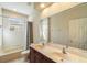 Bright bathroom featuring a double vanity, large mirror, and a shower/tub combo at 1712 Whitney Isles Dr, Windermere, FL 34786