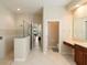 Bright bathroom featuring a glass shower, tile flooring, and a neutral color palette at 1712 Whitney Isles Dr, Windermere, FL 34786