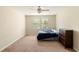 A light and airy bedroom with plush carpet and a large window at 1712 Whitney Isles Dr, Windermere, FL 34786