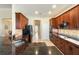 Gourmet kitchen features granite countertops, custom cabinets, and modern stainless steel appliances at 1712 Whitney Isles Dr, Windermere, FL 34786