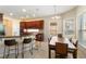 Eat-in kitchen features custom cabinets, granite countertops, stainless steel appliances, and recessed lighting at 1712 Whitney Isles Dr, Windermere, FL 34786