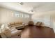 Second floor living room featuring wood floors, ample seating, and natural light at 1712 Whitney Isles Dr, Windermere, FL 34786