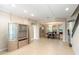 Spacious living room with tile flooring, recessed lighting, and an open layout to dining area at 1712 Whitney Isles Dr, Windermere, FL 34786