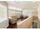 Bright upstairs living room with ample seating, neutral decor, and natural light at 1712 Whitney Isles Dr, Windermere, FL 34786