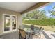 Outdoor patio with a seating area and landscaped view at 1712 Whitney Isles Dr, Windermere, FL 34786