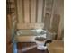 A dated bathroom with a bathtub, toilet, and sink, in need of repairs and updating at 1804 Mable Butler Ave, Orlando, FL 32805