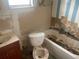 Bathroom with damaged walls and flooring, needing complete renovation at 1804 Mable Butler Ave, Orlando, FL 32805
