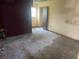 Empty bedroom with worn flooring and damaged walls needing renovation at 1804 Mable Butler Ave, Orlando, FL 32805