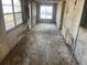 Living room with damaged walls and floors, needing complete renovation at 1804 Mable Butler Ave, Orlando, FL 32805