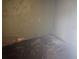Empty storage room with damaged walls and flooring, requiring renovation at 1804 Mable Butler Ave, Orlando, FL 32805