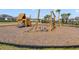 Community playground with wooden playset and wood chips at 2019 Rainier Dr, Kissimmee, FL 34746