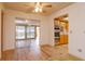 Dining area with wood floors and access to both the kitchen and sunroom at 2206 Winter Woods Blvd, Winter Park, FL 32792