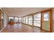 Sunroom with light-colored laminate flooring and plenty of natural light at 2206 Winter Woods Blvd, Winter Park, FL 32792