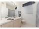 Bathroom with shower/tub, vanity, and window at 2303 Butterfly Palm Way # 201, Kissimmee, FL 34747