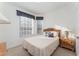 Cozy bedroom with a double bed, window and nightstand at 2303 Butterfly Palm Way # 201, Kissimmee, FL 34747