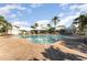 Resort-style pool with a large deck and shaded seating areas at 2303 Butterfly Palm Way # 201, Kissimmee, FL 34747