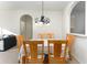 Dining room with a light-colored table and chairs, and a chandelier at 2303 Butterfly Palm Way # 201, Kissimmee, FL 34747