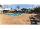 Resort-style pool with lounge chairs and patio area at 2303 Butterfly Palm Way # 201, Kissimmee, FL 34747