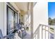 Private balcony with patio furniture and view of trees at 231 Goldenrain Dr # 4304, Celebration, FL 34747
