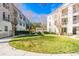 Landscaped courtyard with circular walkway and green space at 231 Goldenrain Dr # 4304, Celebration, FL 34747