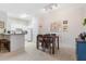 Combined kitchen and dining area with table and chairs at 231 Goldenrain Dr # 4304, Celebration, FL 34747