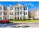 Three-story condo building with traditional architecture and balconies at 231 Goldenrain Dr # 4304, Celebration, FL 34747