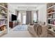 Spacious living room with large windows and built-in shelves at 231 Goldenrain Dr # 4304, Celebration, FL 34747