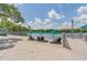 Relaxing waterfront area with seating and umbrellas at 231 Goldenrain Dr # 4304, Celebration, FL 34747