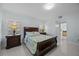 Bedroom with a queen bed, nightstand and view of a bathroom at 2625 Star Lake View Dr, Kissimmee, FL 34747