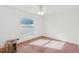 Well-lit bedroom featuring pink carpet and a window at 2729 Peggy Dr, Kissimmee, FL 34744