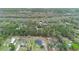 Aerial view of property surrounded by trees and other homes at 30810 Nocatee Trl, Sorrento, FL 32776