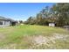 Large grassy backyard with storage sheds at 30810 Nocatee Trl, Sorrento, FL 32776