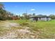 Exterior rear view of home and fenced yard at 30810 Nocatee Trl, Sorrento, FL 32776