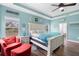 Primary bedroom featuring a tray ceiling, ceiling fan, and decorative furnishings at 30810 Nocatee Trl, Sorrento, FL 32776