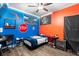 Cozy bedroom features colorful walls, ceiling fan, and wood laminate flooring at 30810 Nocatee Trl, Sorrento, FL 32776