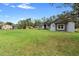 Charming single-story home with gray siding and green lawn at 30810 Nocatee Trl, Sorrento, FL 32776