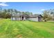 Single-story home with well-manicured lawn and mature trees at 30810 Nocatee Trl, Sorrento, FL 32776