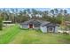 Inviting one-story home with a well-manicured lawn on a spacious lot at 30810 Nocatee Trl, Sorrento, FL 32776