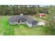 Well-maintained one-story home, showcasing a spacious grassy yard at 30810 Nocatee Trl, Sorrento, FL 32776