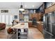 Modern kitchen with a center island, stainless steel appliances, and an open layout at 30810 Nocatee Trl, Sorrento, FL 32776