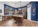 Kitchen featuring stainless steel appliances, center island with seating, and wood-look floors at 30810 Nocatee Trl, Sorrento, FL 32776