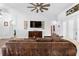 Spacious living room with high ceiling, fan, and seamless archway at 30810 Nocatee Trl, Sorrento, FL 32776
