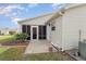 House exterior showcasing a screened patio and landscaping at 3405 Forsythe Ter, The Villages, FL 32162