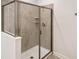 Shower with glass enclosure and neutral tile at 4209 Paragraph Dr, Kissimmee, FL 34746