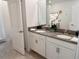 Double vanity with gray countertops and white cabinets at 4209 Paragraph Dr, Kissimmee, FL 34746