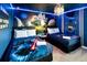 Twin beds, Star Wars mural, and blue color scheme at 4209 Paragraph Dr, Kissimmee, FL 34746